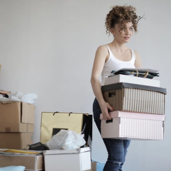 Moving posessions Woman moving her boxes of posessions
