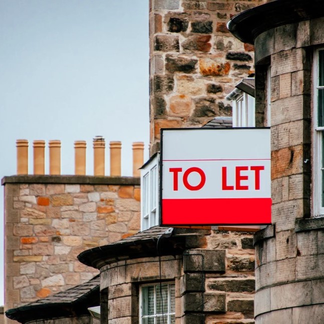 to let to let sign on the side of a house