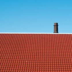 Property manager checking roof drainage and gutters